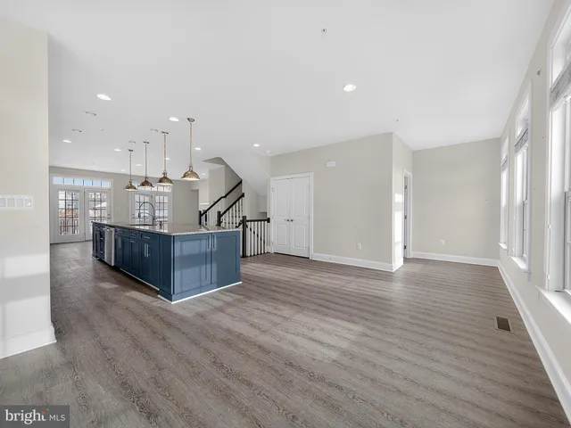 a view of kitchen with furniture and wooden floor