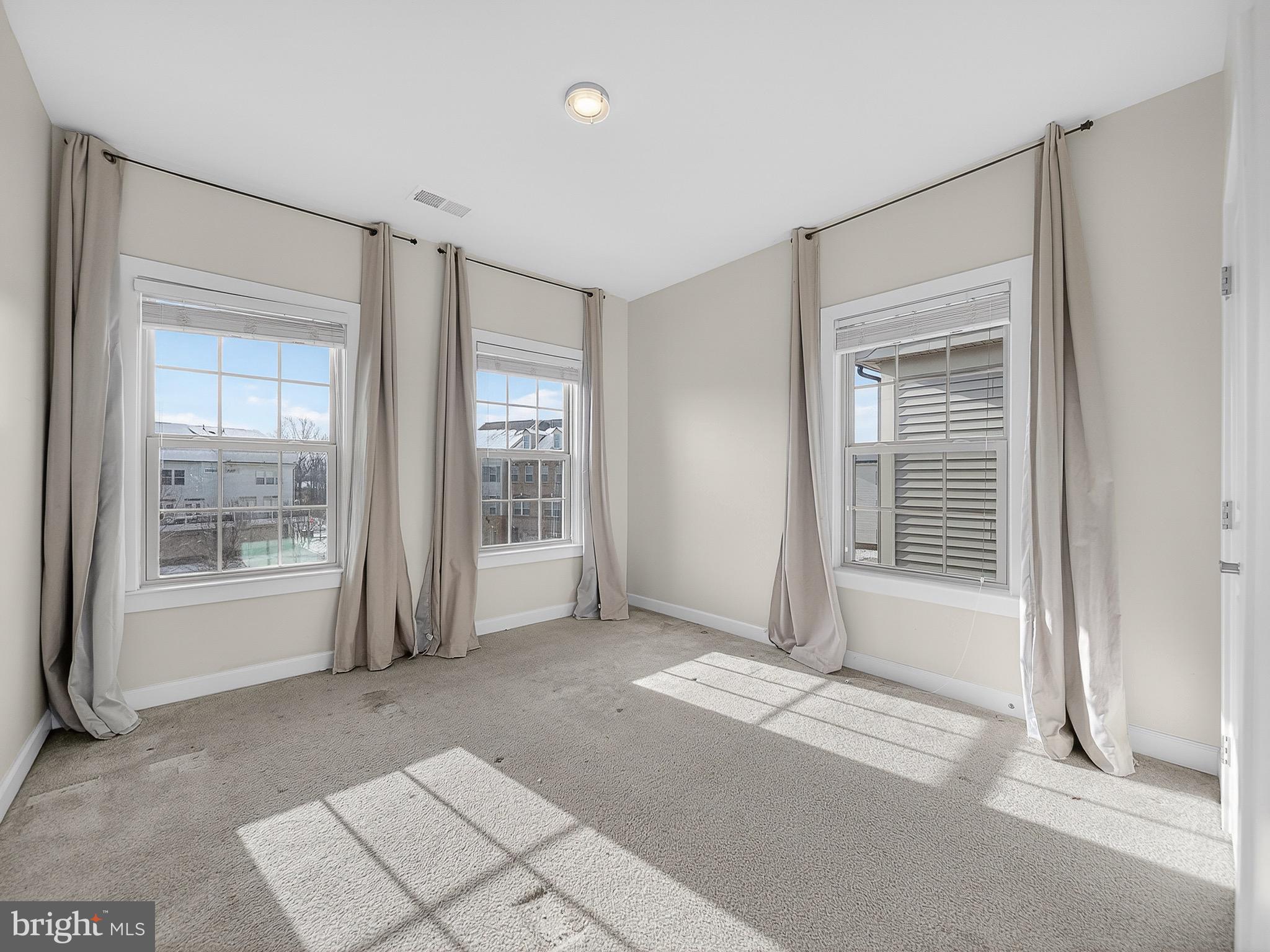 2914 Middleham Court Hanover, MD 21076 - Photo 22 of 50 a view of empty room with wooden floor and fan