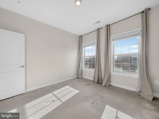 a view of empty room with windows