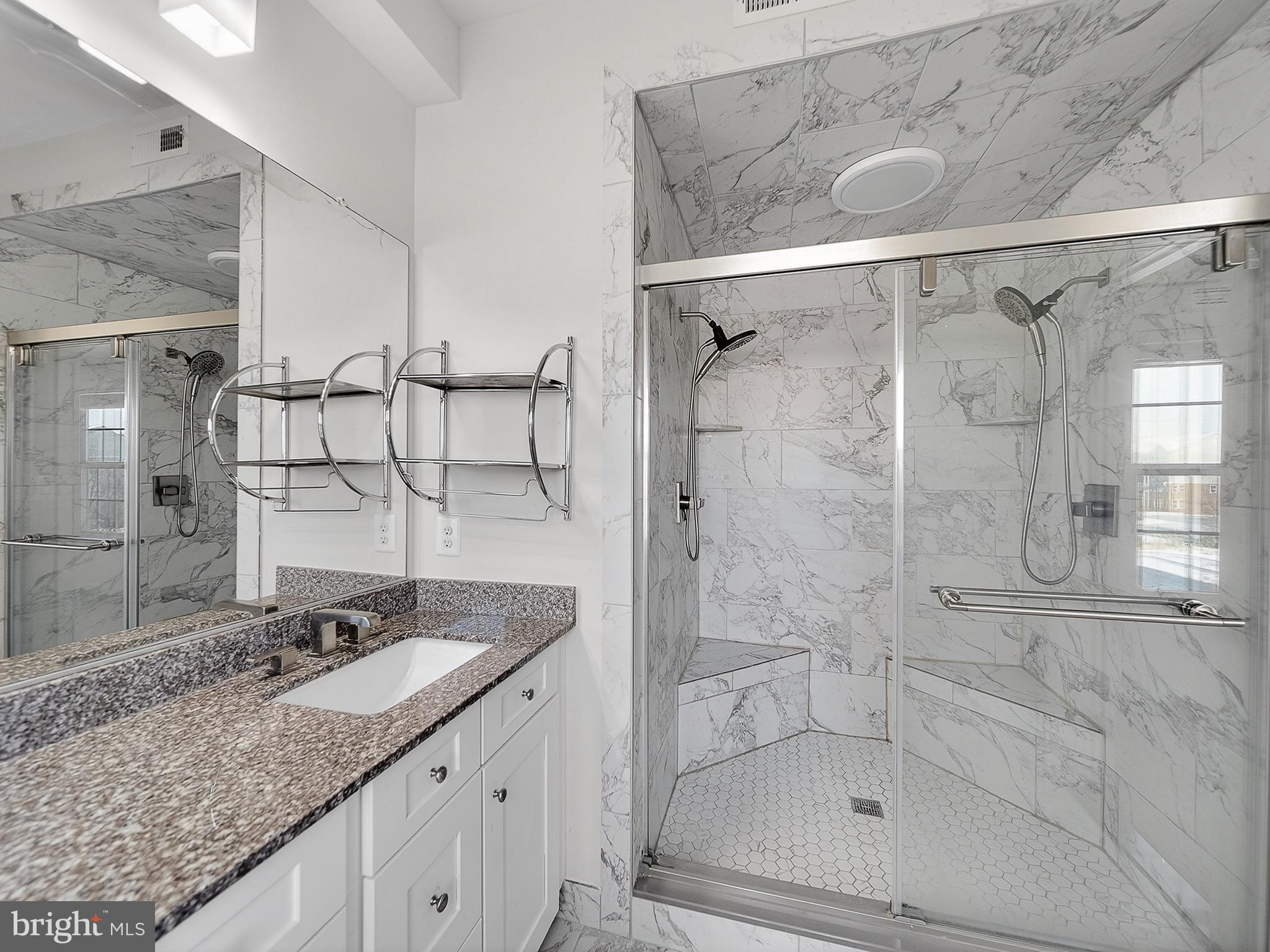 2914 Middleham Court Hanover, MD 21076 - Photo 31 of 50 a bathroom with a granite countertop sink mirror and shower