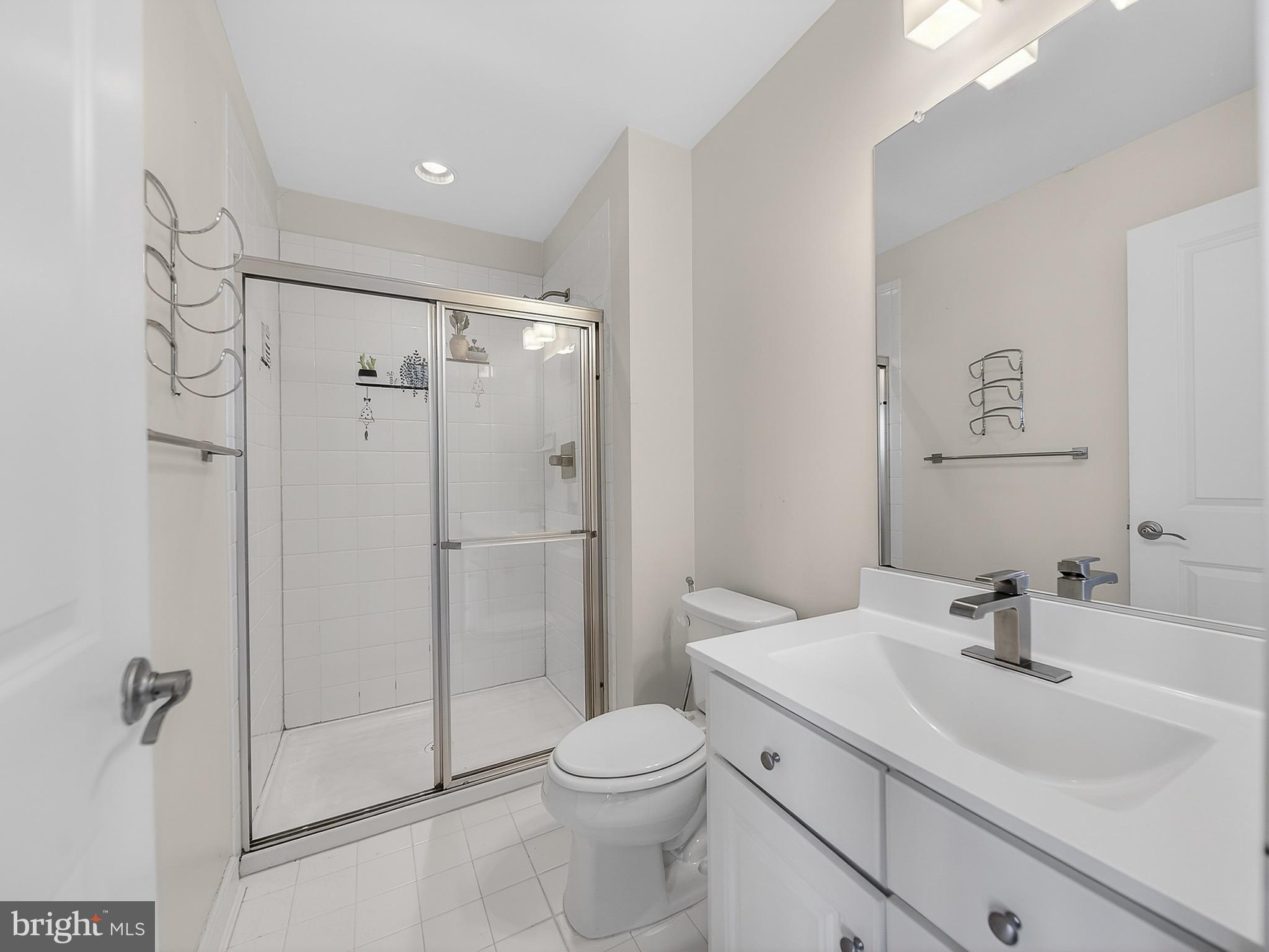 2914 Middleham Court Hanover, MD 21076 - Photo 35 of 50 a bathroom with a sink toilet and shower