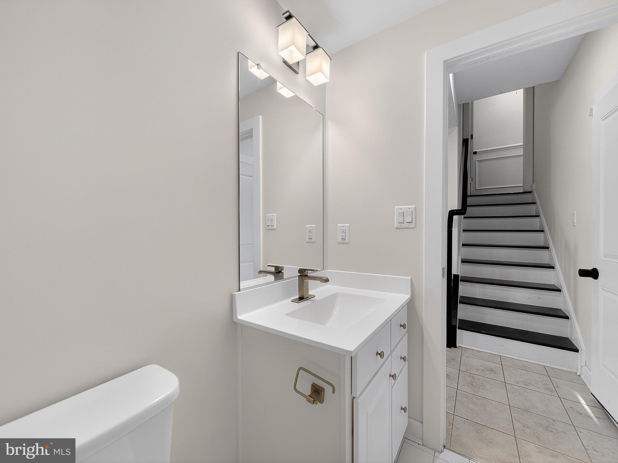 2914 Middleham Court Hanover, MD 21076 - Photo 41 of 50 a bathroom with a sink and a mirror