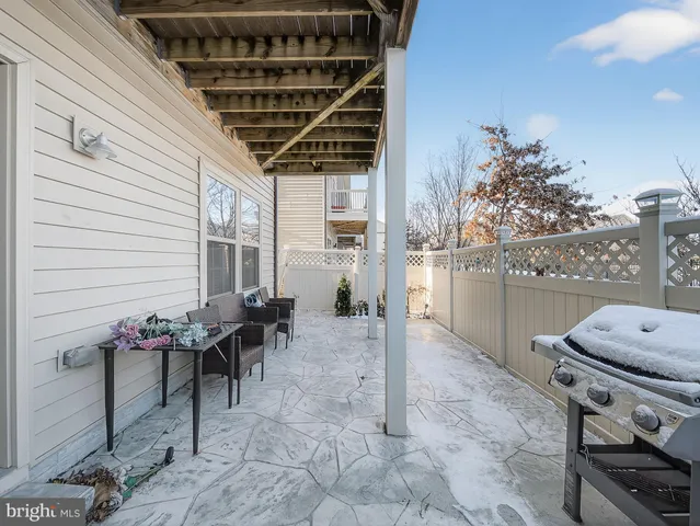 a dining room with furniture and flowers