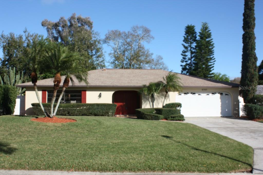 6565 Exeter Court Seminole, FL 33772 - Photo 1 of 1 a view of a house with a yard