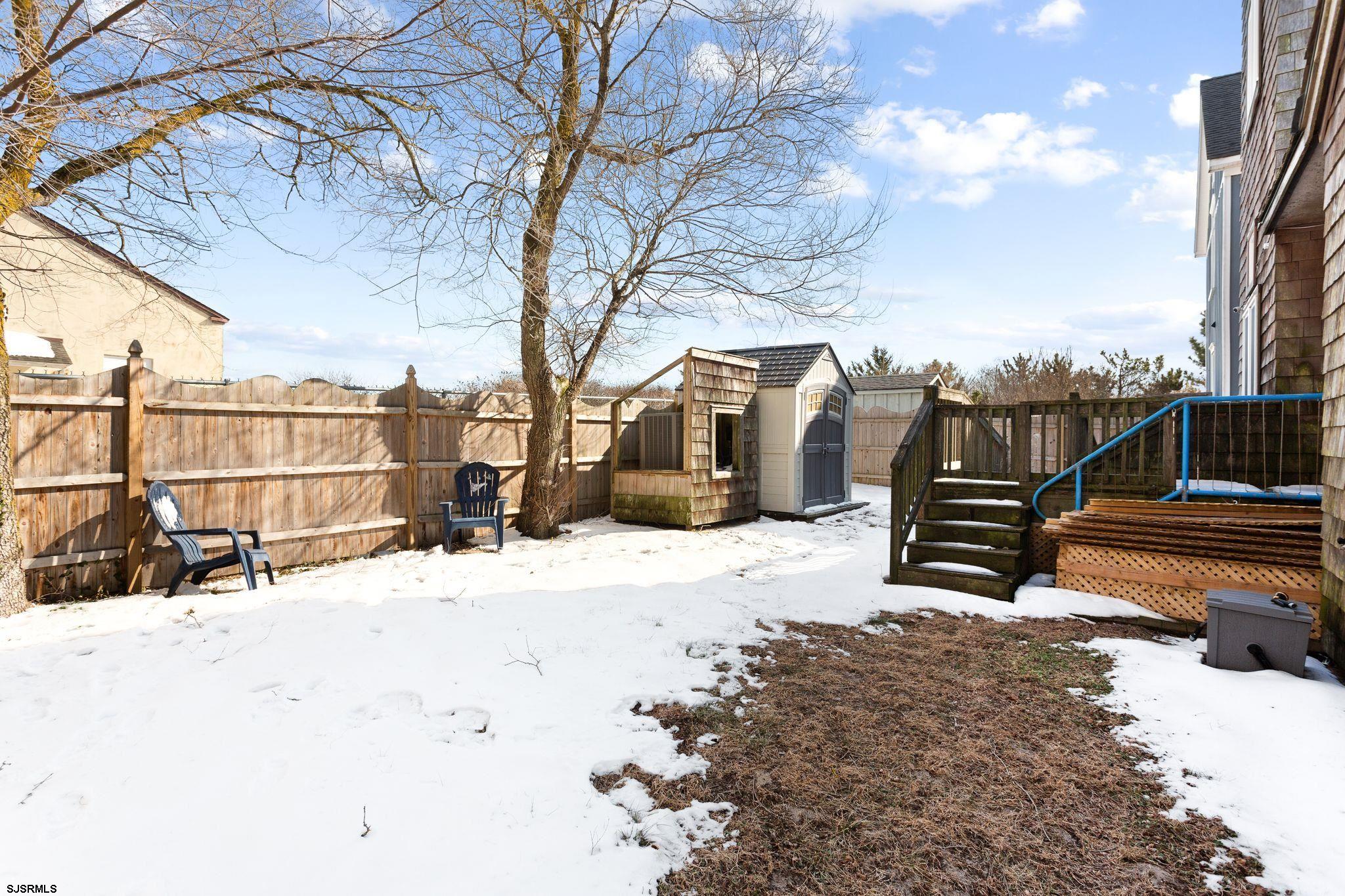 701 Lighthouse Road Cape May Point, NJ 08212 - Photo 27 of 32 a view of a backyard with wooden fence