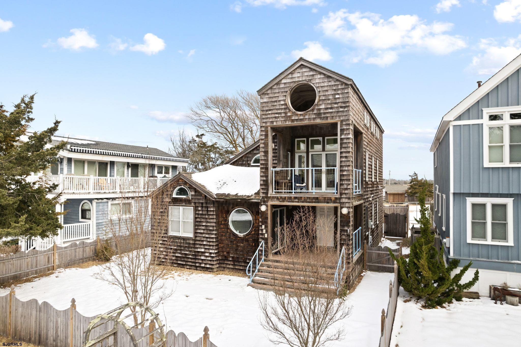 701 Lighthouse Road Cape May Point, NJ 08212 - Photo 32 of 32 a front view of a house with a yard