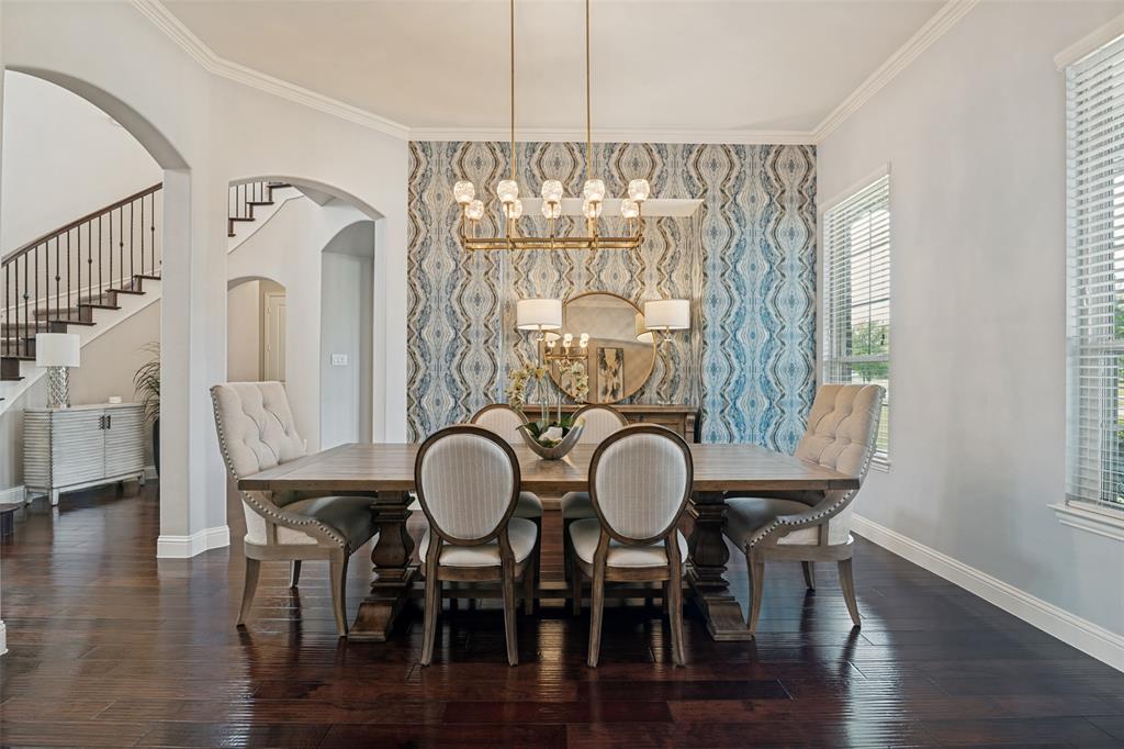 388 Bethany Road Sunnyvale, TX 75182 - Photo 6 of 40 Formal dining space featuring dark pre engineered wood-finish flooring and a decorative accent wall