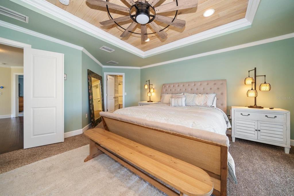 478 Harbor Drive South Indian Rocks Beach, FL 33785 - Photo 21 of 68 a bedroom with a bed and a chandelier