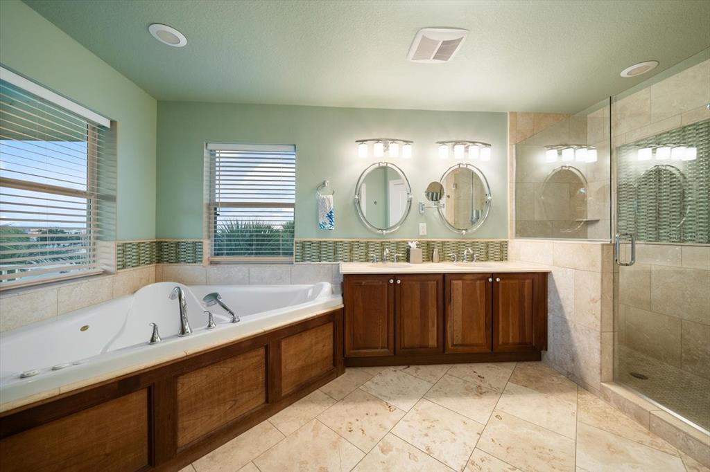 478 Harbor Drive South Indian Rocks Beach, FL 33785 - Photo 23 of 68 a bathroom with a sink mirror and a bathtub
