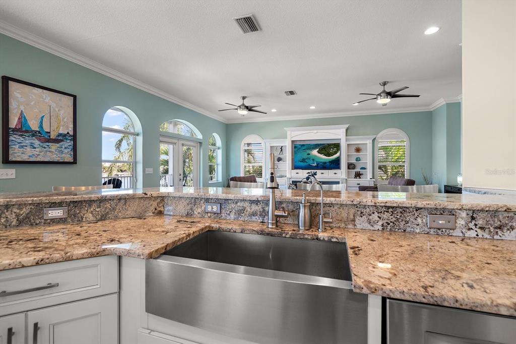 478 Harbor Drive South Indian Rocks Beach, FL 33785 - Photo 38 of 68 a kitchen with a sink and a granite counter tops