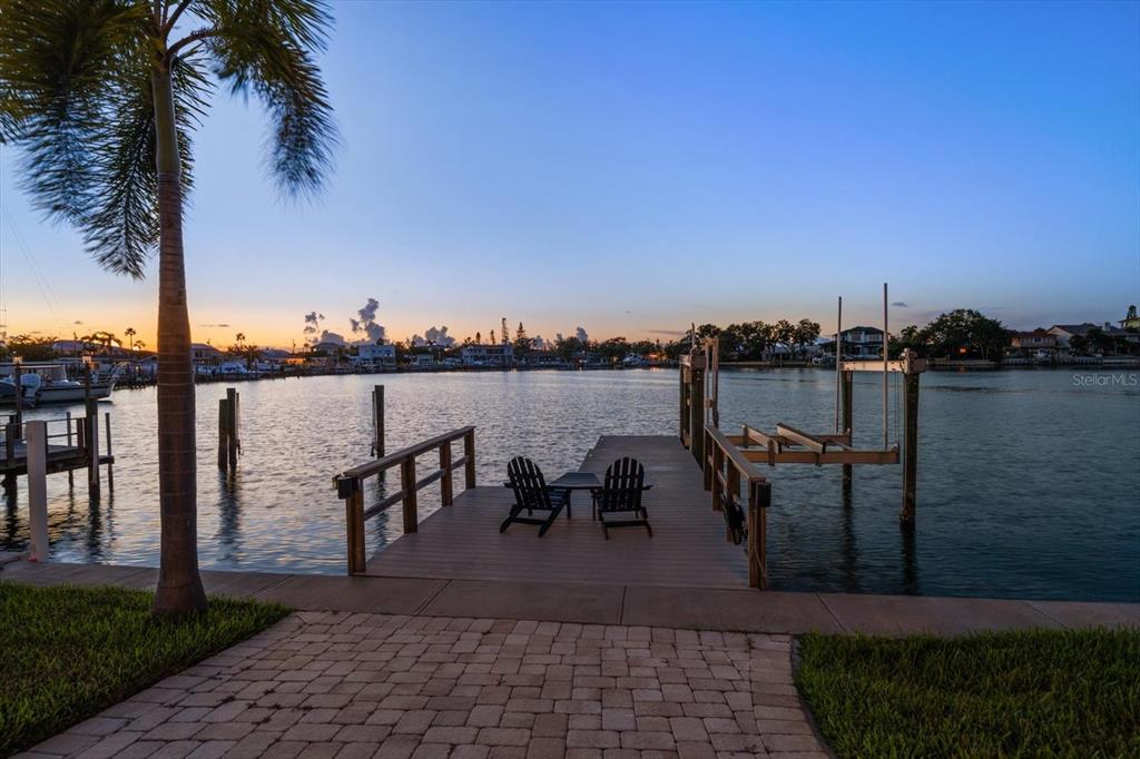 478 Harbor Drive South Indian Rocks Beach, FL 33785 - Photo 54 of 68 a view of a lake with table and chairs