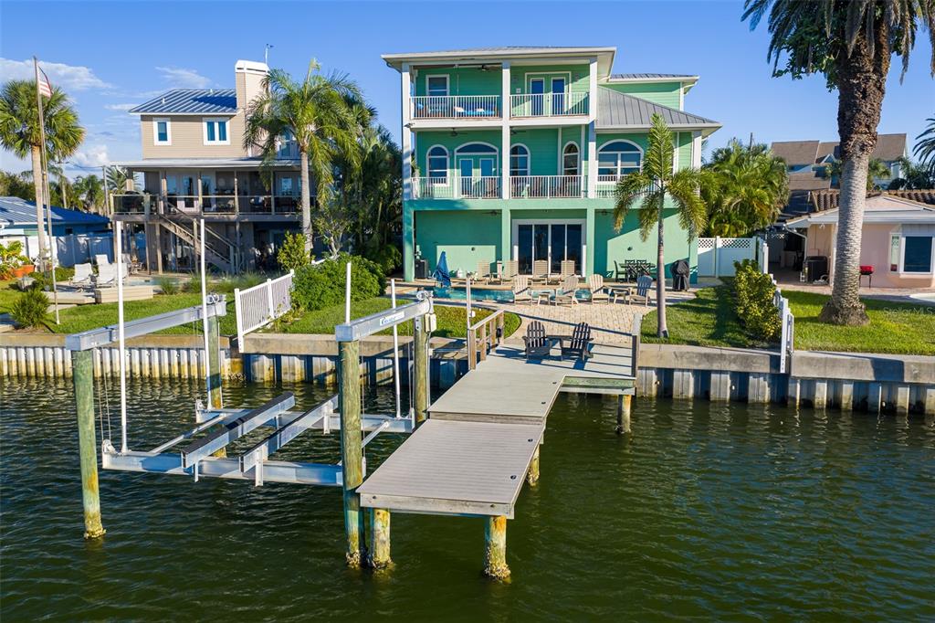 478 Harbor Drive South Indian Rocks Beach, FL 33785 - Photo 61 of 68 a view of a swimming pool with outdoor seating