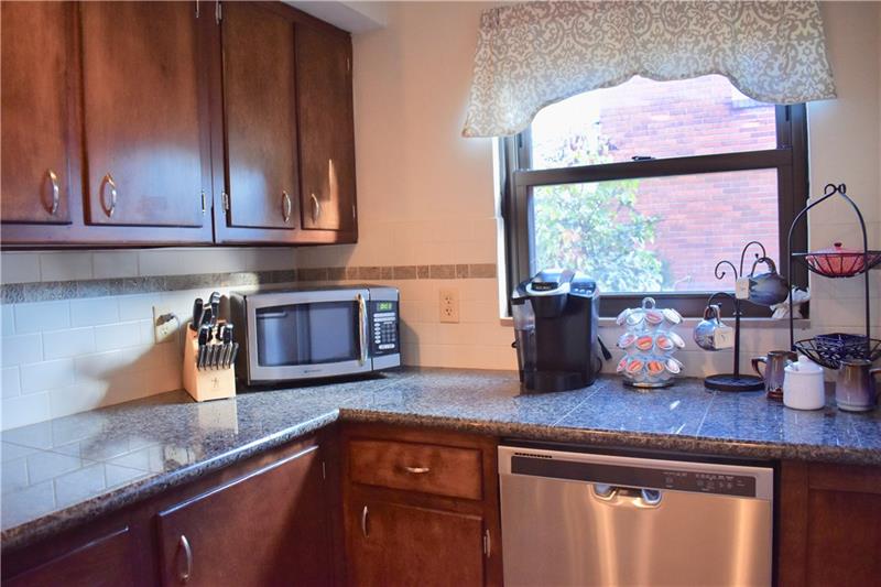 26 Robinhood Road Pittsburgh, PA 15220 - Photo 13 of 25 Want to have your first cup of coffee in the morning? Look no further...your own coffee bar! Updated and reconfigured kitchen with granite counter tops, new stainless steel appliances, new flooring and so much more!