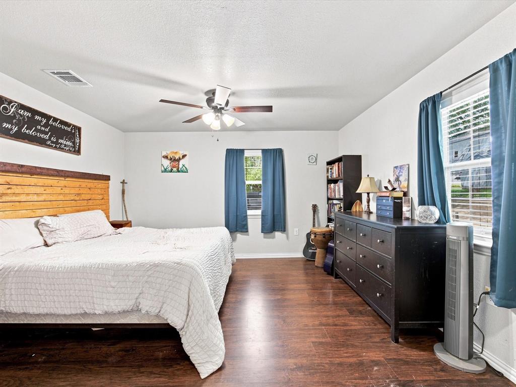 408 Inwood Road Azle, TX 76020 - Photo 18 of 32 Wood-finish flooring, white walls, and a ceiling fan with integrated lighting