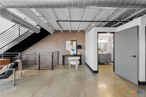 a view of a livingroom with furniture