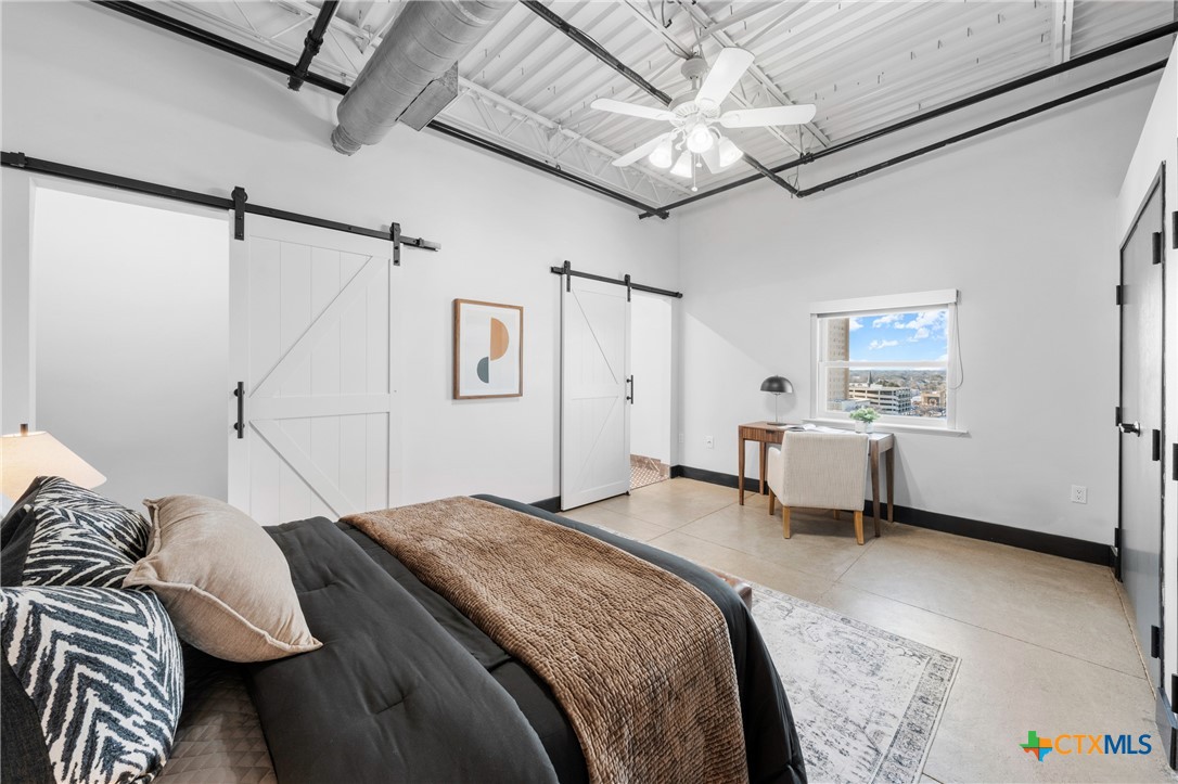 219 South 4th Street, Unit 608 Waco, TX 76701 - Photo 23 of 42 a bedroom with a bed and a window