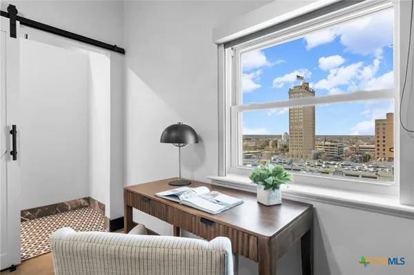 a bedroom with a bed and a couch