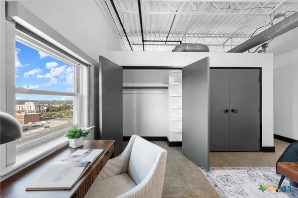 a kitchen with sink and cabinets