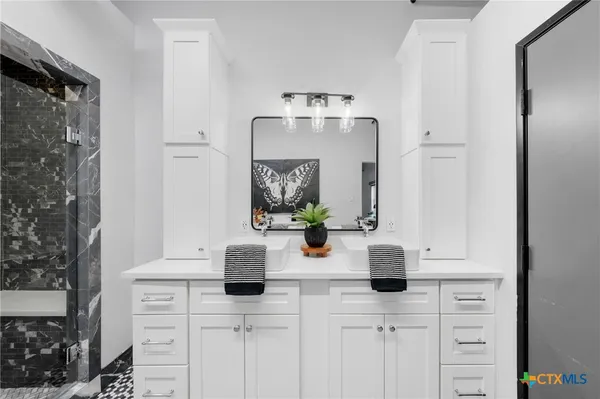 a bathroom with a sink and a mirror