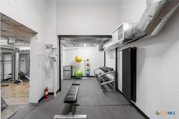 a view of a room with gym equipment
