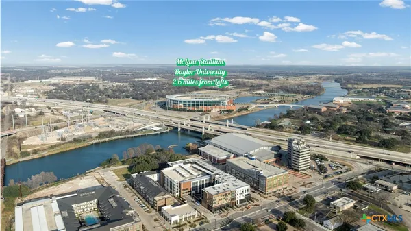 a view of a livingroom with furniture and a window