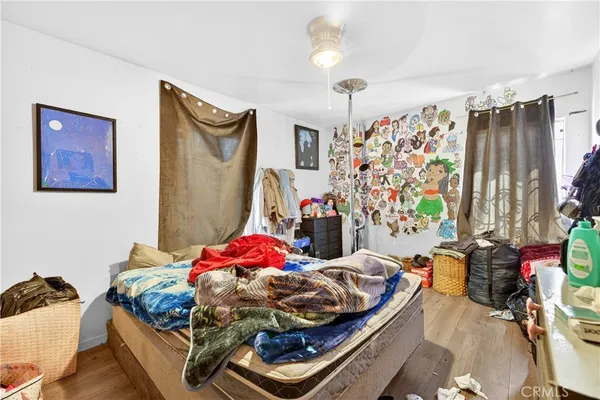 a bedroom with bed and a window