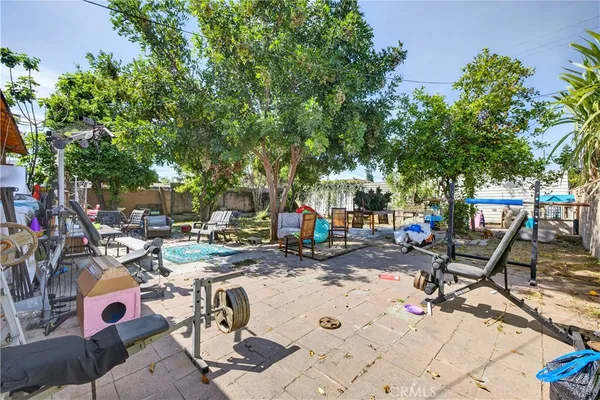 a view of a backyard with sitting area