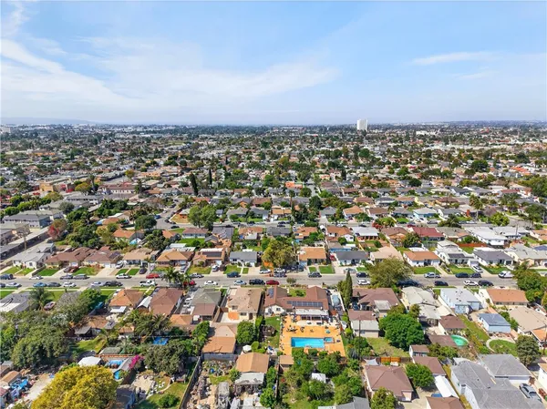 an aerial view of residential building with green space