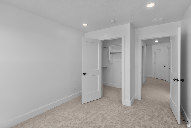 1213 West 500 South Logan, UT 84321 - Photo 19 of 29 Carpeted room with recessed lighting and white baseboards