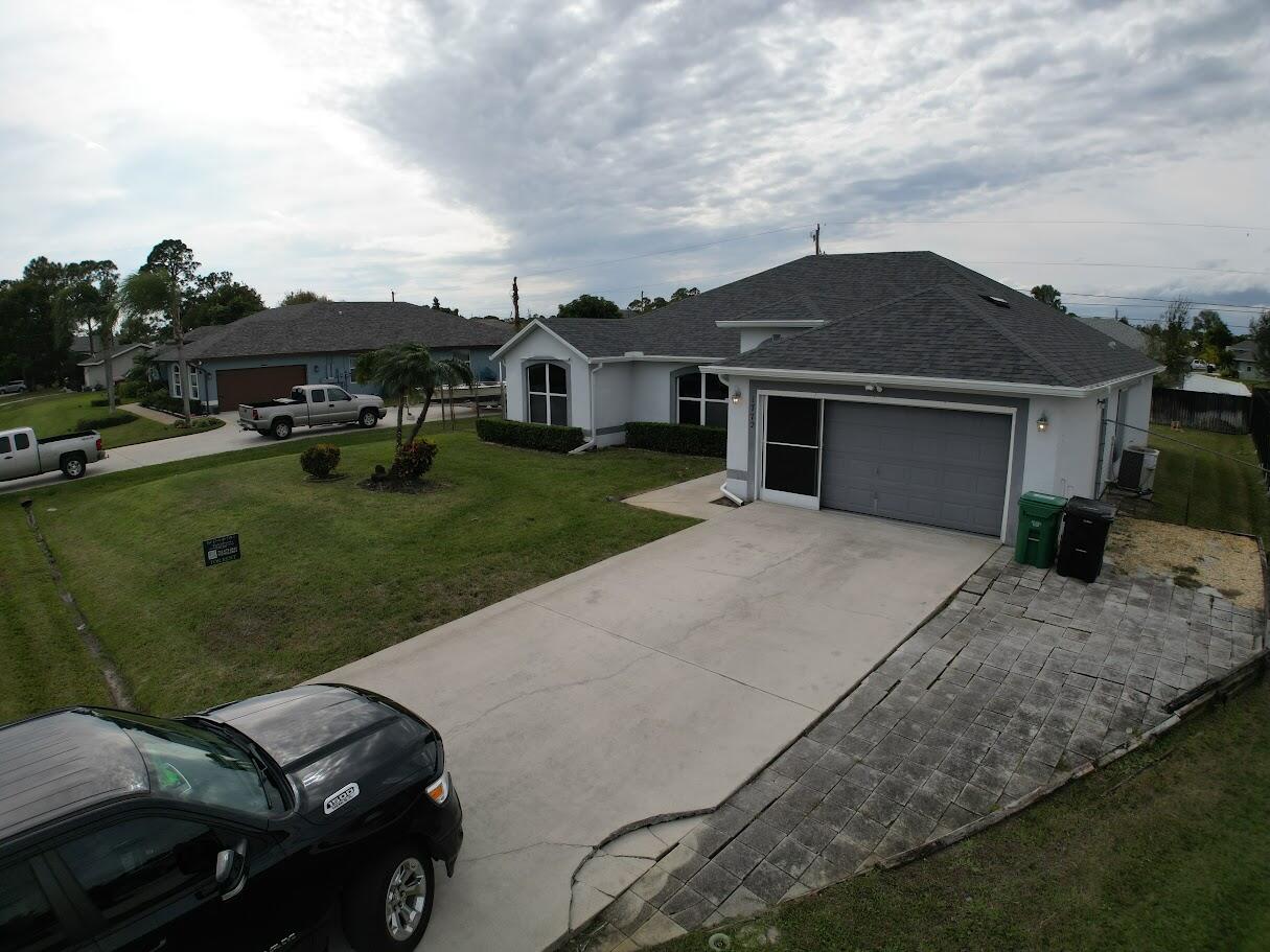 1772 Southwest Bonanza Street Port St. Lucie, FL 34953 - Photo 2 of 34 dji_fly_20260118_134852_30_1768765761421