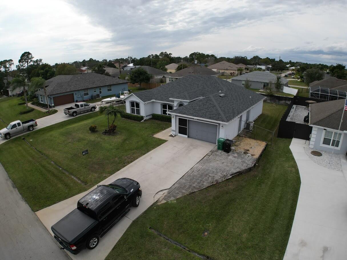 1772 Southwest Bonanza Street Port St. Lucie, FL 34953 - Photo 3 of 34 dji_fly_20260118_134900_31_1768765762377