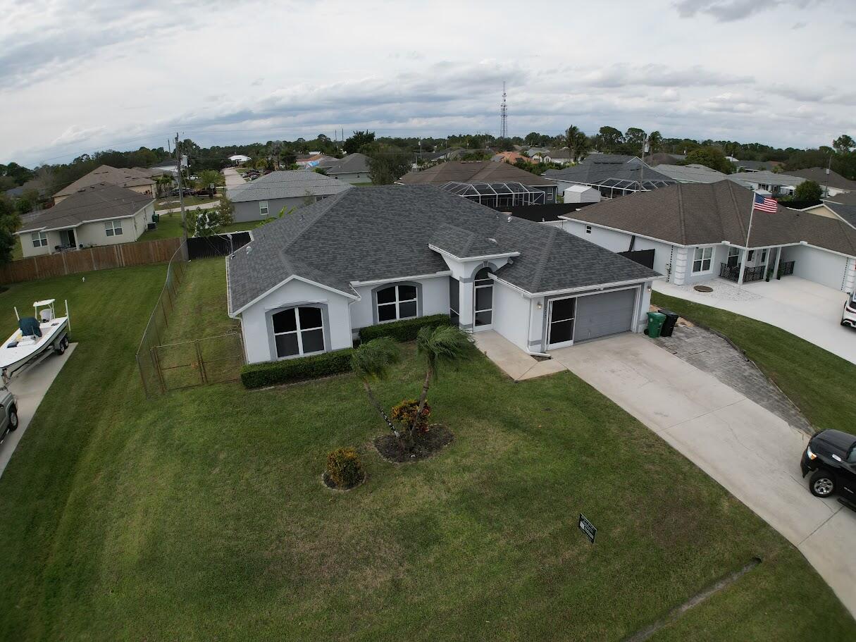 1772 Southwest Bonanza Street Port St. Lucie, FL 34953 - Photo 4 of 34 dji_fly_20260118_134910_32_1768765764182