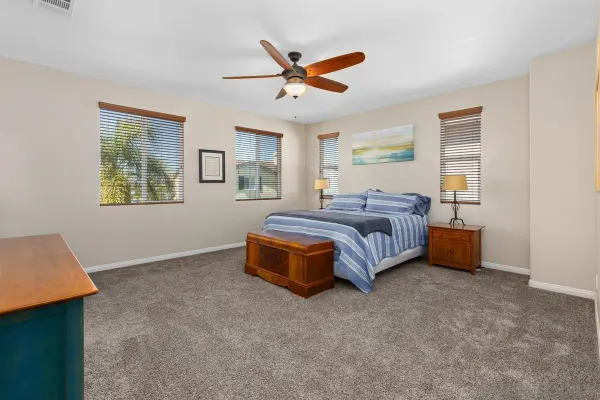 a spacious bedroom with a bed and window