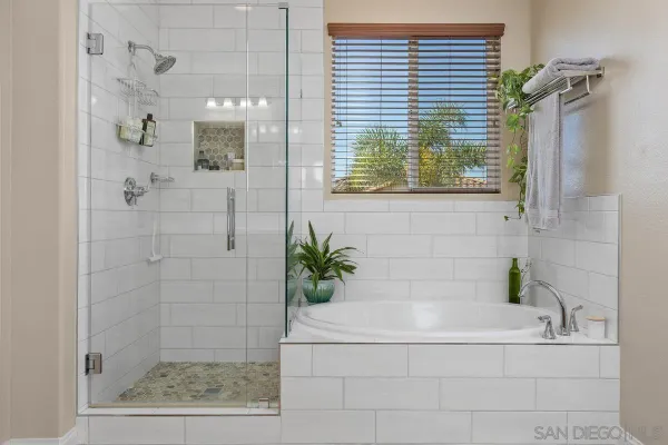 a bathroom with a bathtub and shower