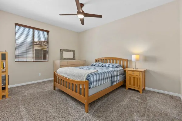 a bedroom with a bed and window