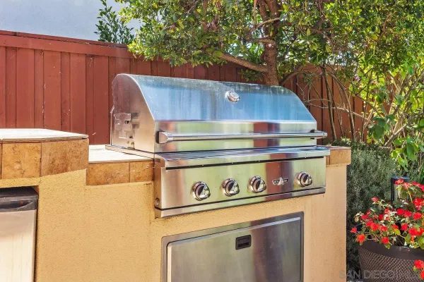 a view of a back yard with an outdoor space