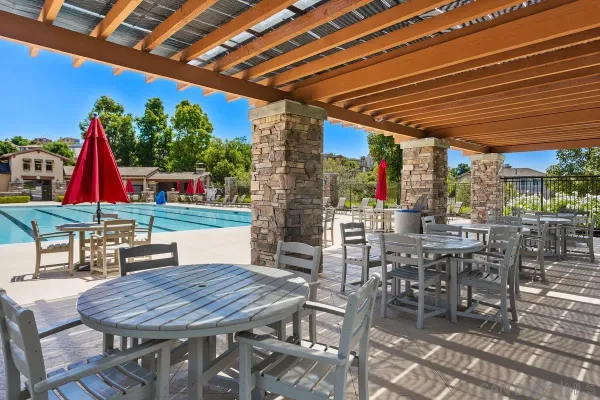 a patio with a table and chairs