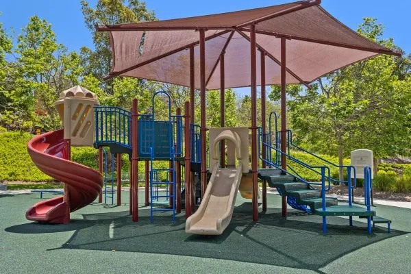 a patio with a table and chairs