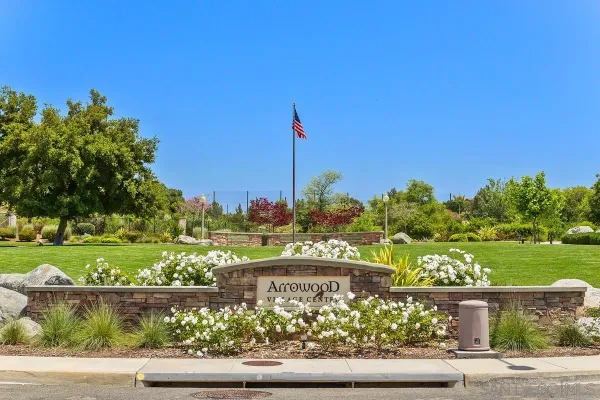 a view of a yard with a table and a chair
