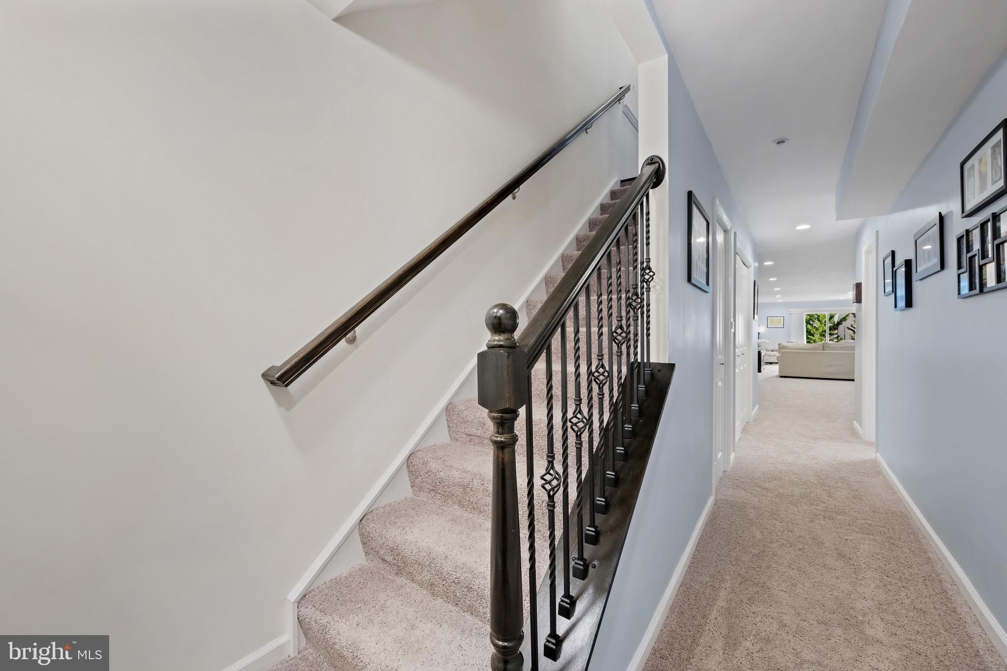 313 Lennox Drive Fallston, MD 21047 - Photo 43 of 66 Stairs with carpet flooring. Wrought Iron railing