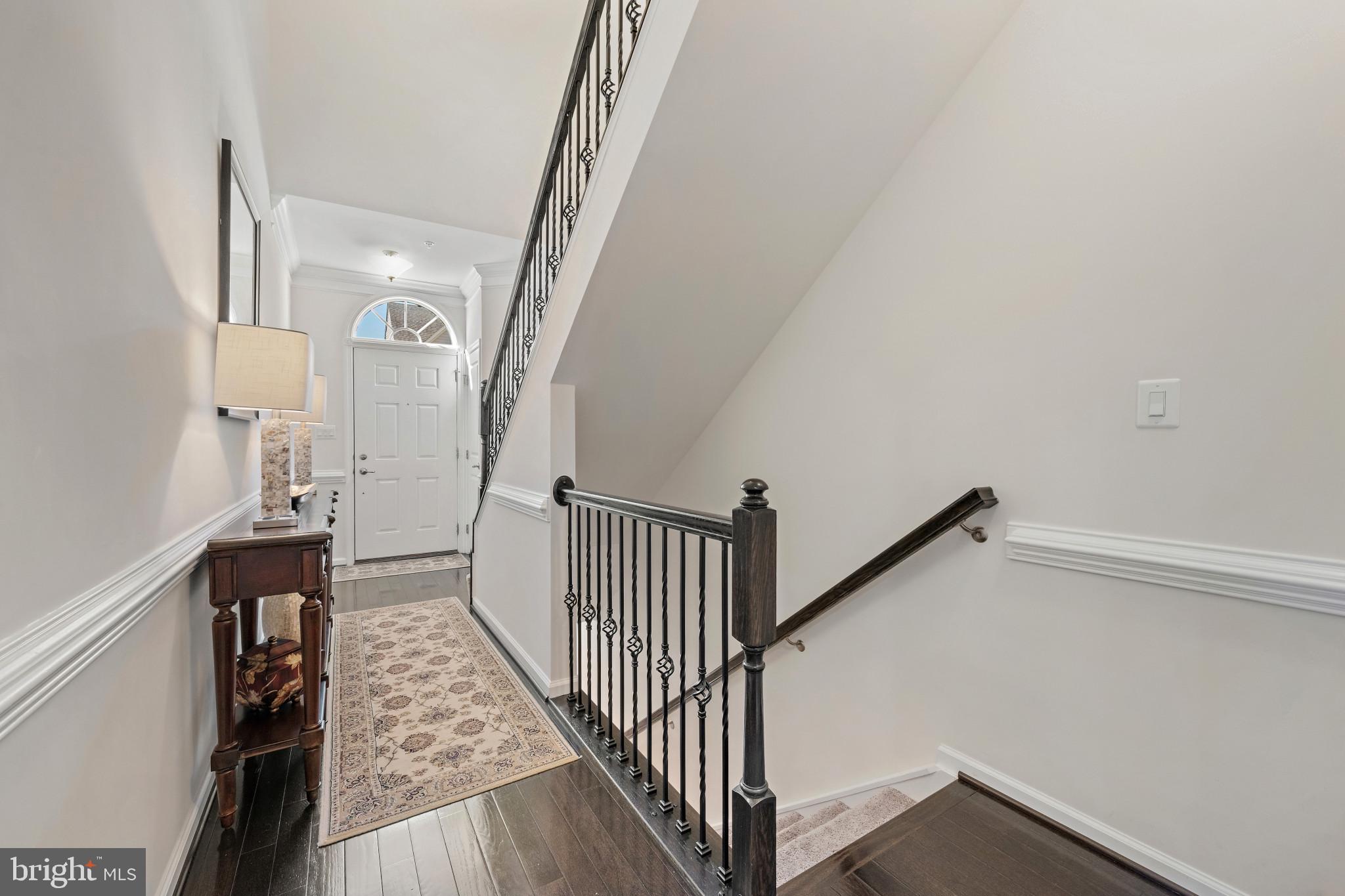 313 Lennox Drive Fallston, MD 21047 - Photo 7 of 66 Stairway to lower level with hardwood floored hall