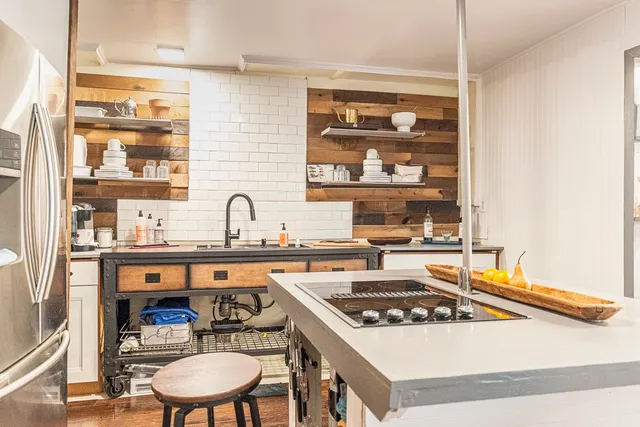 a kitchen with a stove and a sink