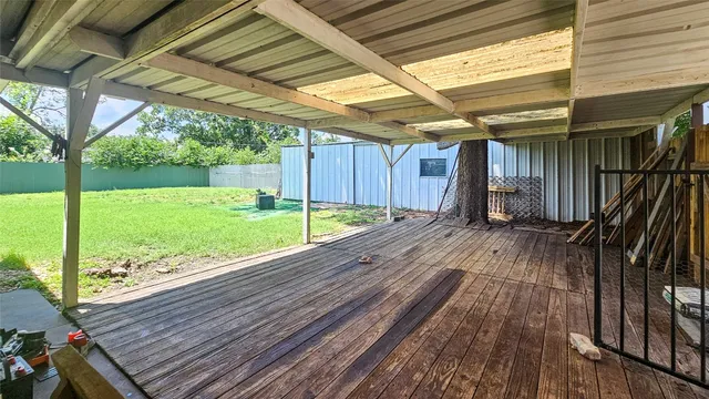 a view of a backyard with wooden floor