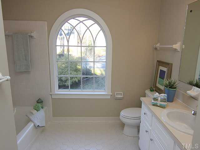 4311 Swarthmore Road Durham, NC 27707 - Photo 10 of 12 Secondary bath on 2nd floor with decorative curved window. Bathroom