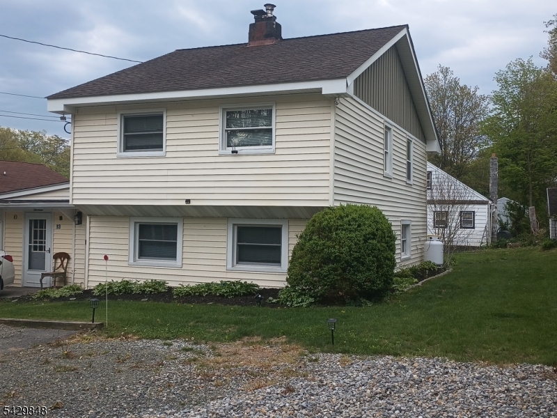13 Ardena Road West Milford, NJ 07421 - Photo 1 of 14 a front view of a house with garden