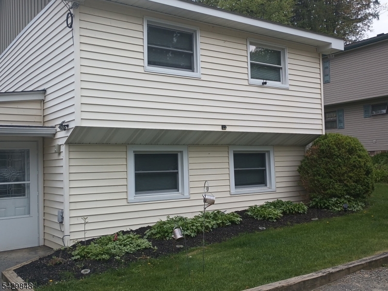 13 Ardena Road West Milford, NJ 07421 - Photo 2 of 14 a view of a white house next to a yard