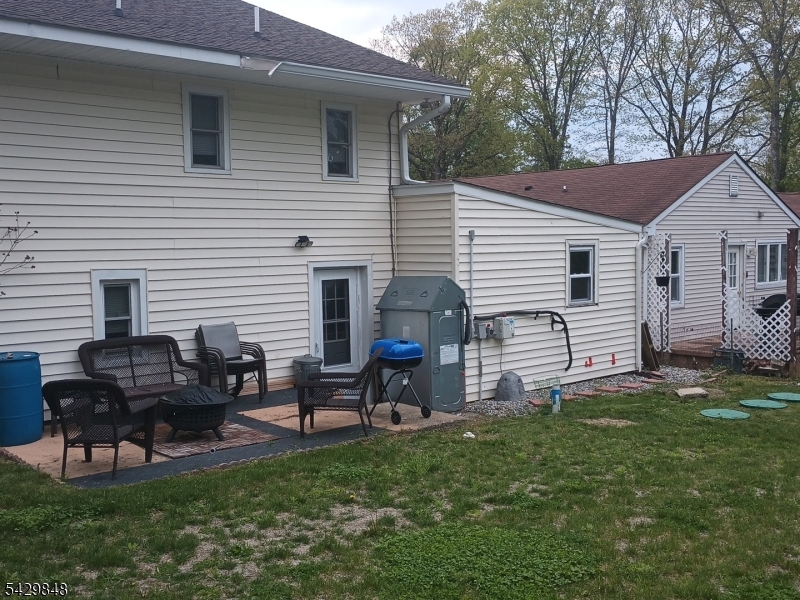13 Ardena Road West Milford, NJ 07421 - Photo 4 of 14 a backyard of a house with seating space