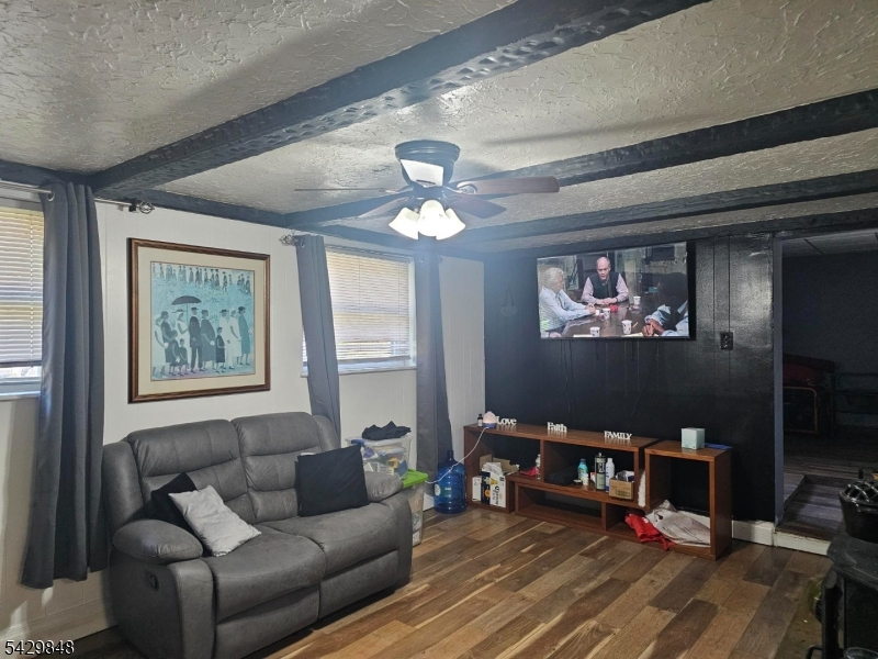 13 Ardena Road West Milford, NJ 07421 - Photo 5 of 14 a living room with furniture a rug and a window