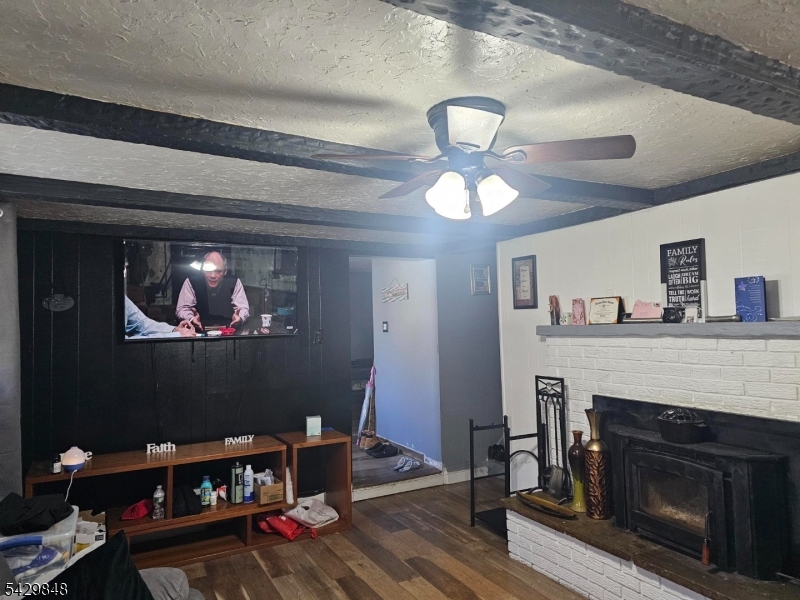 13 Ardena Road West Milford, NJ 07421 - Photo 6 of 14 a living room with furniture and a fireplace
