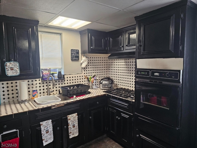13 Ardena Road West Milford, NJ 07421 - Photo 7 of 14 a kitchen with granite countertop stainless steel appliances and cabinets